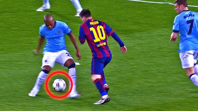 Lionel Messi nutmegs a Manchester City player on his way to scoring a goal
